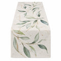 Chemin de table 180 x 33 cm en tissu beige et vert à motif feuillage style botanique